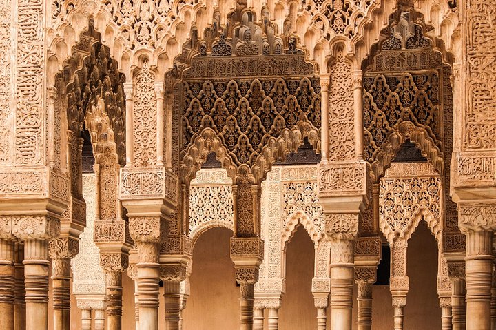 Intricate carved arches and columns in the Nasrid Palaces