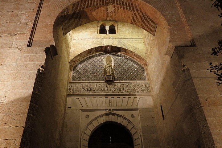 Layered stone and brick arches at the Alhambra’s Gate of Justice