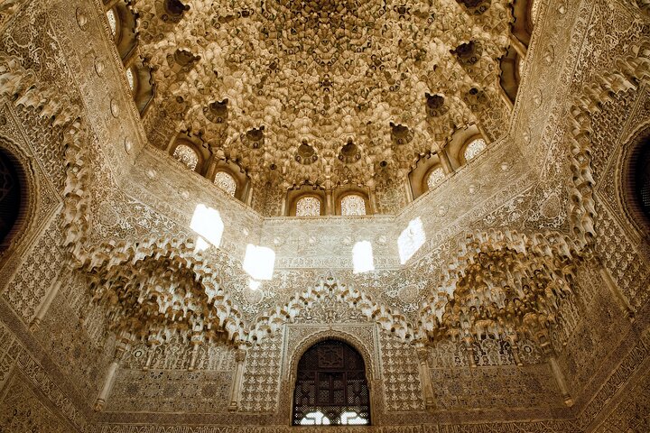 An intricate muqarnas dome inside the Nasrid Palaces