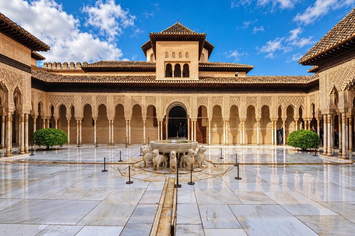 The Court of the Lions fountain surrounded by marble arcades